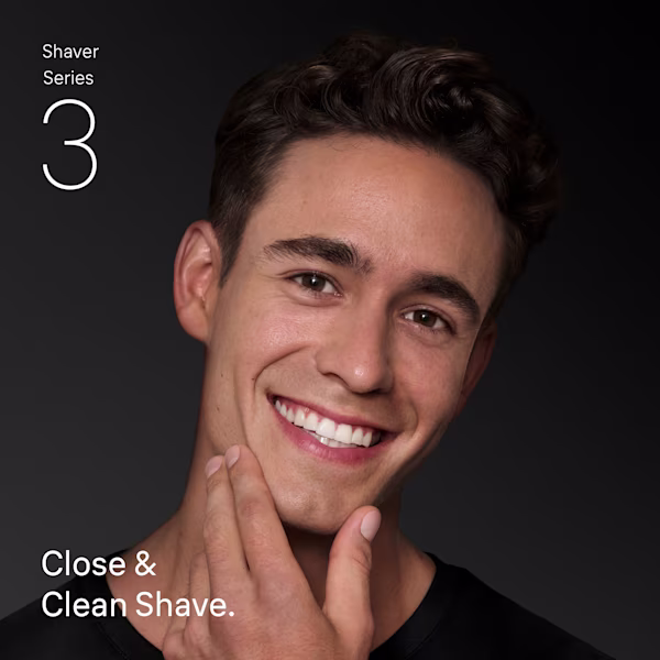 Braun Shaver Series 3+ Close & Clean Shave – smiling man touching smooth skin after shaving.