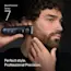 Young man trimming his beard on the side of his face with the Braun Beard Trimmer Series 7