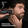 Young man trimming his beard on the side of his face with the Braun Beard Trimmer Series 7