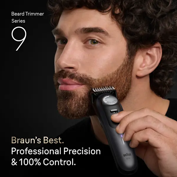 Young man trimming his beard on the side of his face with the Braun Beard Trimmer Series 9