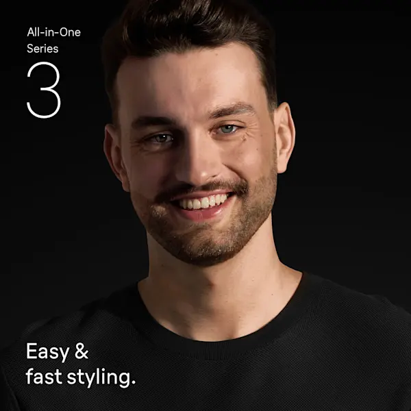 Young man with beard smiling confidently after using the Braun all in one trimmer 3