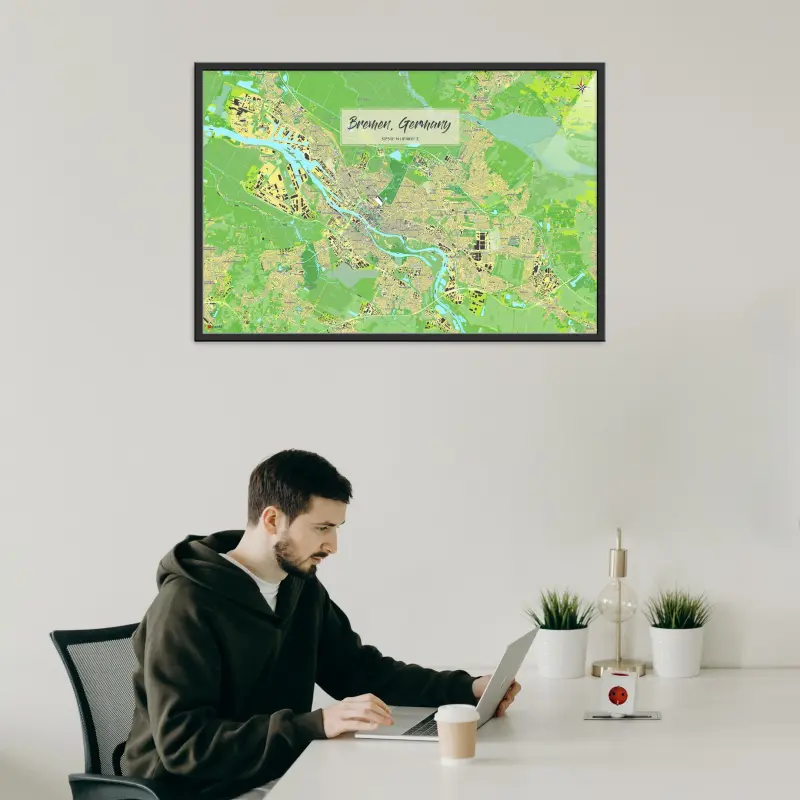 Bremen-Stadtkarte als Poster im Jalma Design in einem Büro mit Mann und Laptop