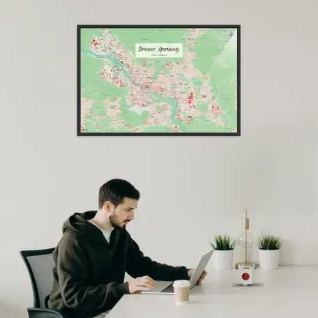 Bremen-Stadtkarte als Poster im Nani Design in einem Büro mit Mann und Laptop