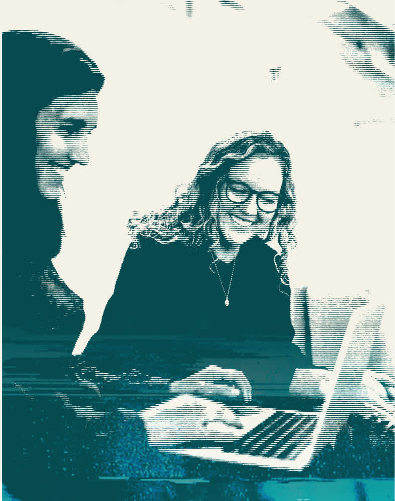 Two women looking at a computer