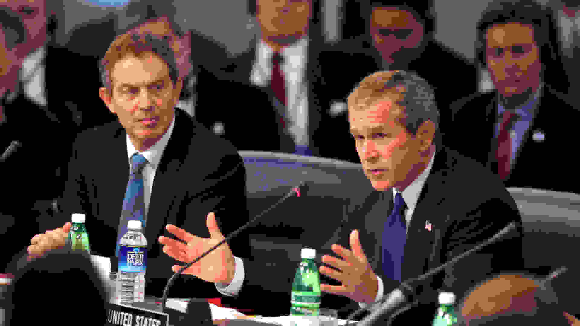 President George W. Bush, seated next to British Prime Minister Tony Blair, addresses world leaders during the meeting of the NATO-Russia Council at Practica di Mare Air Force base near Rome, Italy. ©Public Domain