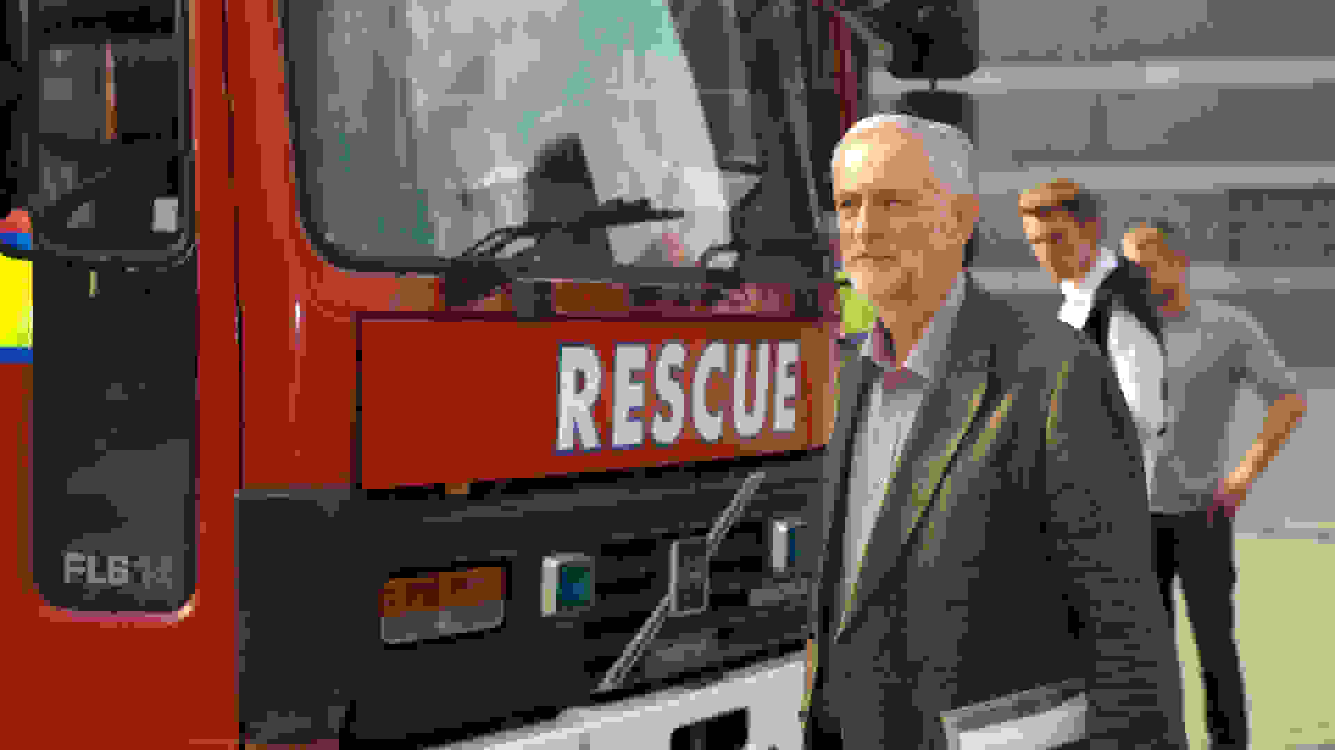 Photo of Jeremy Corbyn stood next to a fire engine with 'Rescue' on the front. Image Courtesy: Bob Peters, Licensed under the Creative Commons Attribution-NonCommercial 2.0