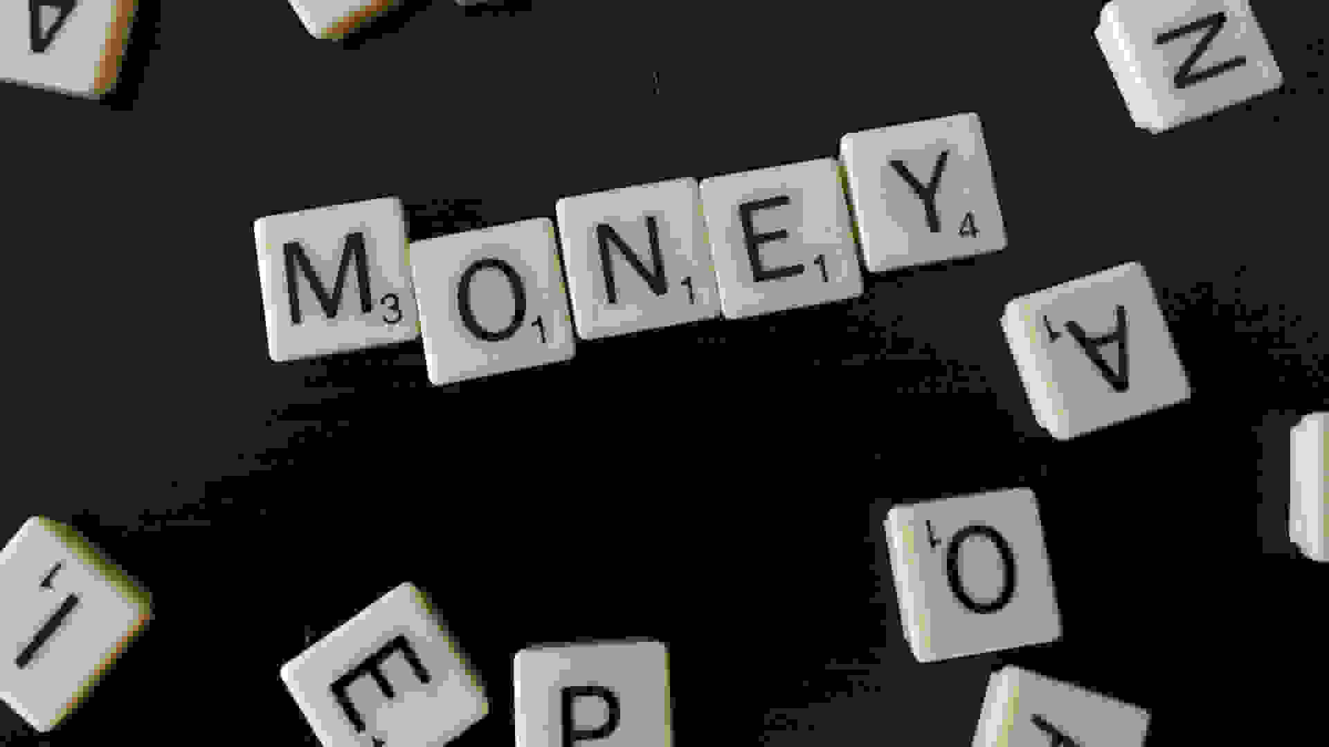 The word 'Money' spelled out in scrabble. Philip Taylor, Licensed under the Creative Commons Attribution 2.0 Generic