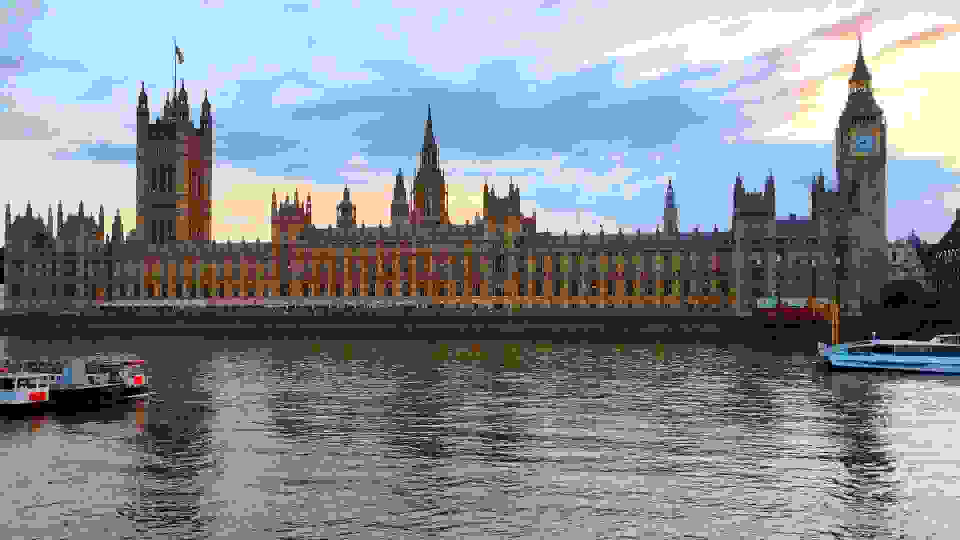 Palace of Westminster river frontage at dusk. Image: Palace of Westminster river frontage at dusk © Hansard Society / Richard Greenhill