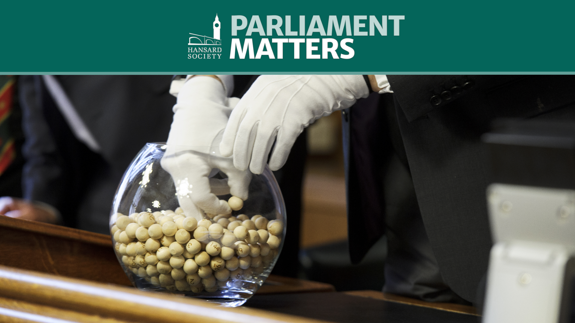 Clerk assistant picks numbered balls from a fishbowl during the Private Members' Bill Ballot. ©House of Commons