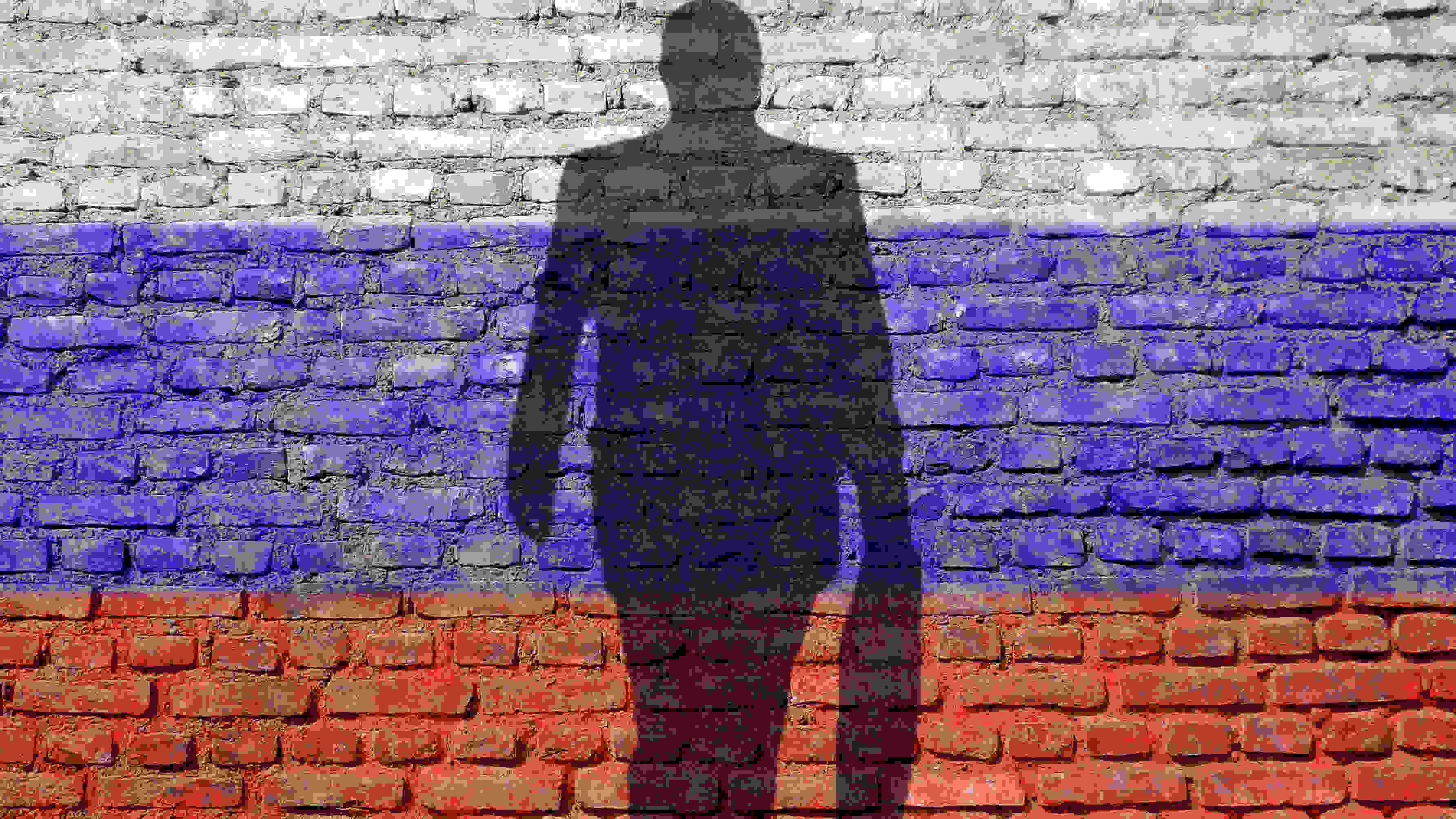 Silhouette of businessman against the Russian flag