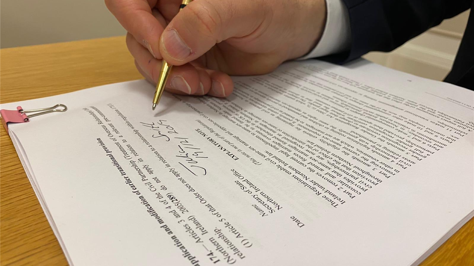 The former Secretary of State for Northern Ireland signing the same-sex marriage regulations for Northern Ireland on 19 December 2019. ©The Rt Hon Julian Smith MP (@JulianSmithUK)