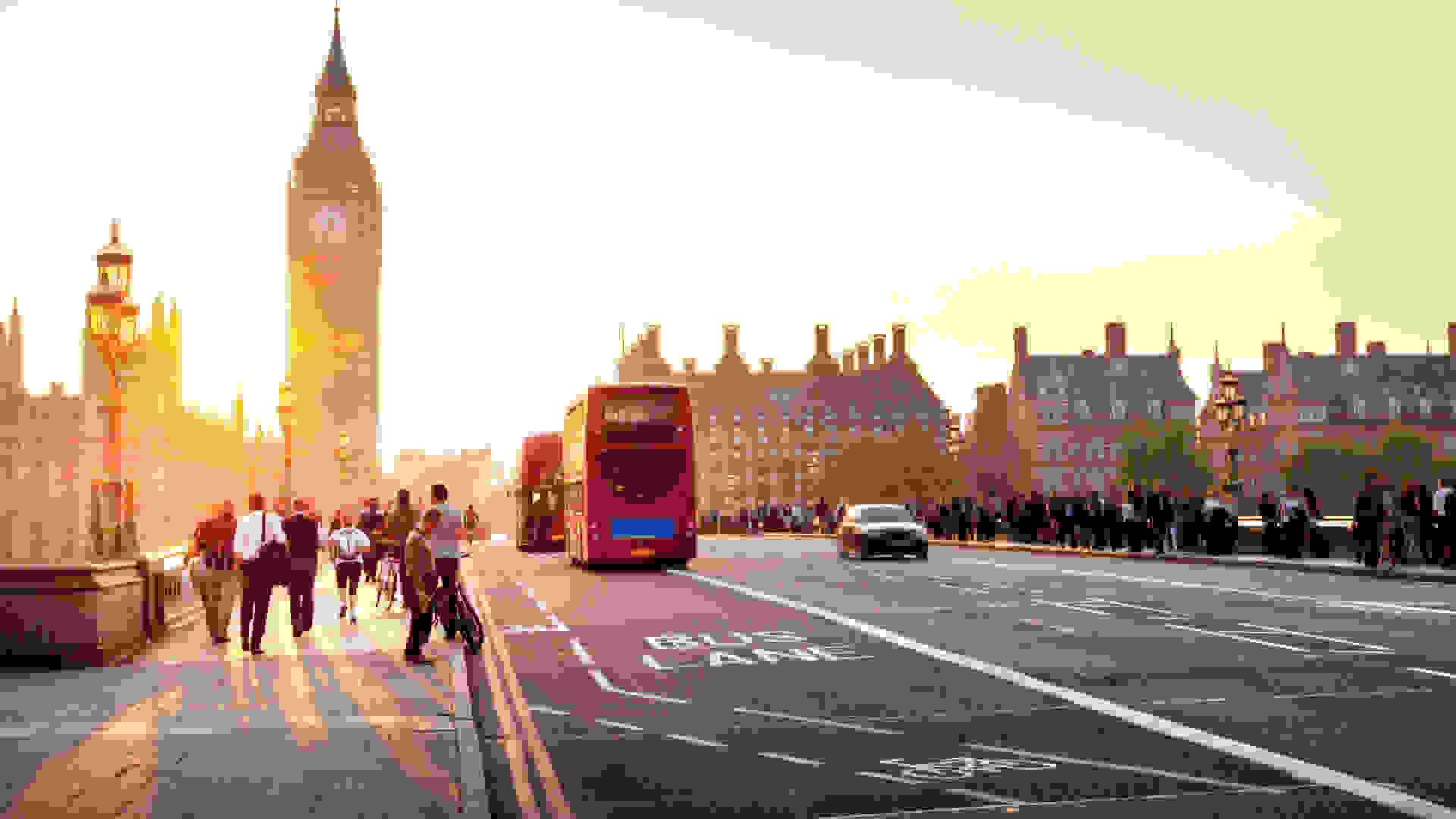 People walking over Westminster Bridge towards the Palace of Westminster, Houses of Parliament