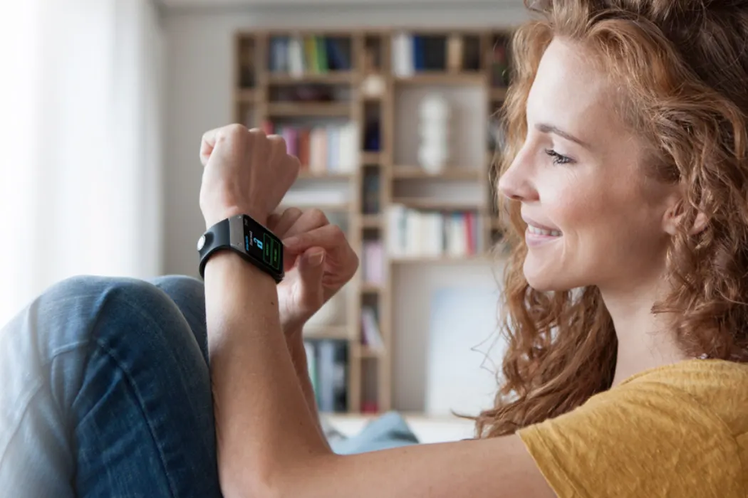 Women on apple watch at home