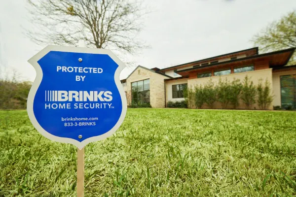 brinks home yard sign in front of a smart home