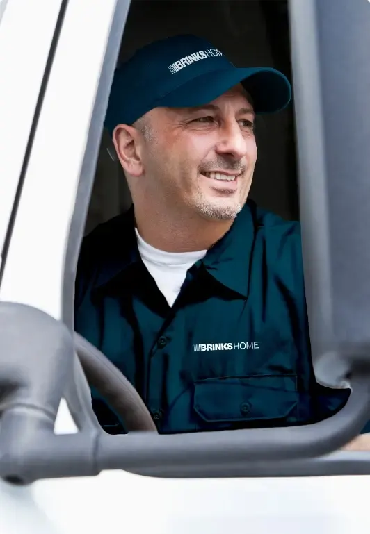 Brinks Home technician driving van