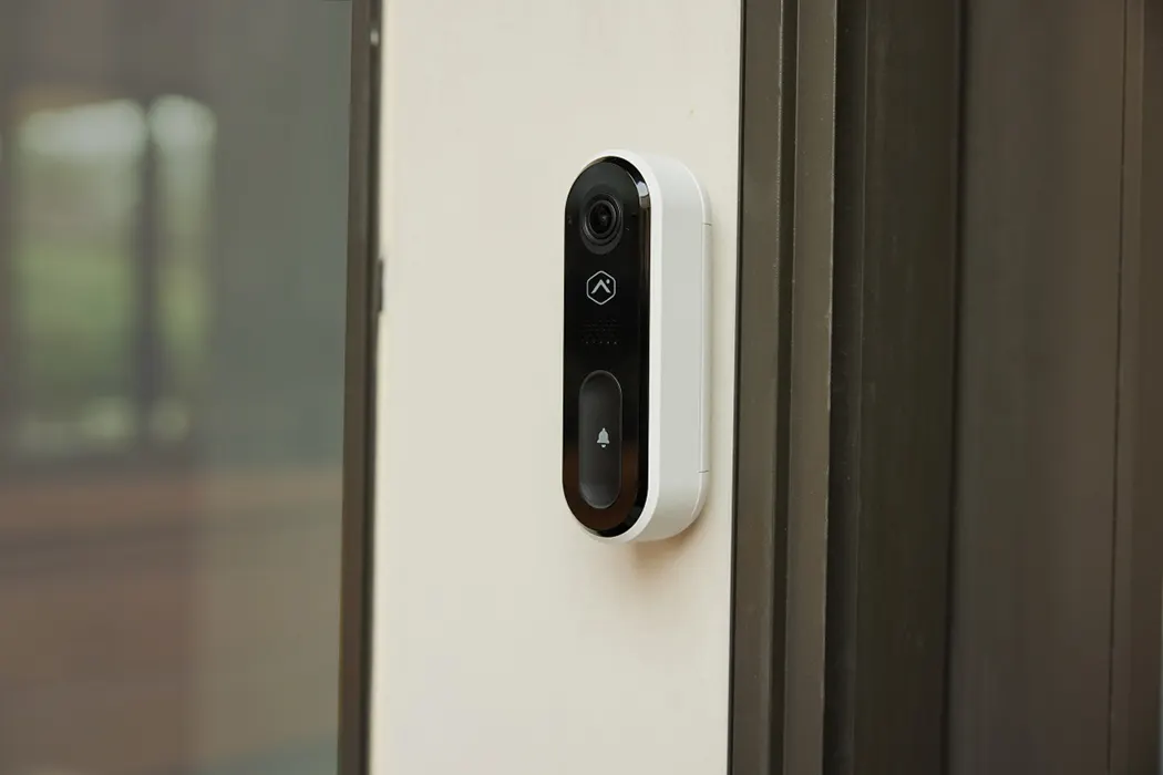 Video doorbell strengthening home security by monitoring entryway activity.