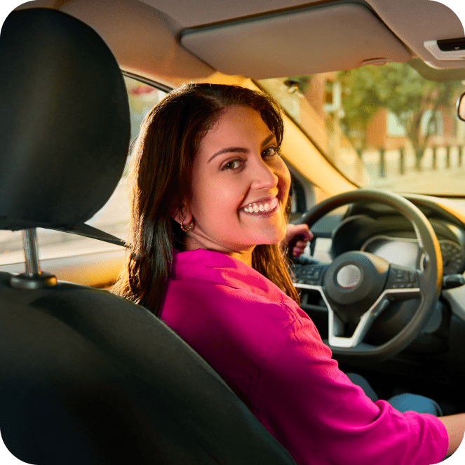 Woman Smiling driving the car
