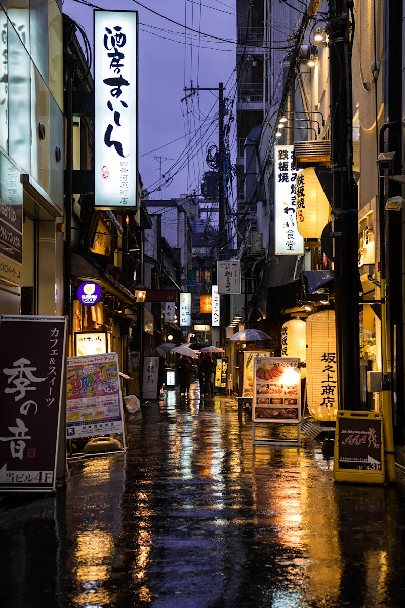 Neon-lit streets and atmospheric rain scenes from Kyoto and Tokyo.