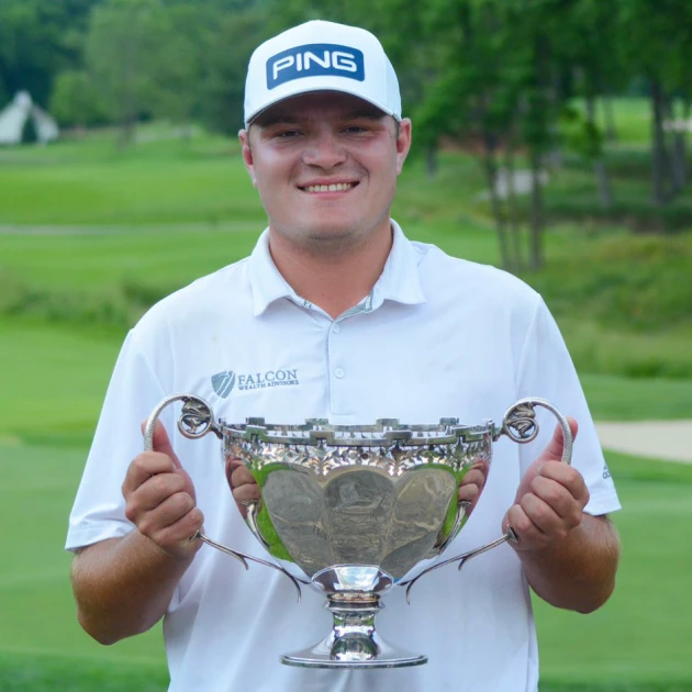 Andy Spencer Holding Trophy