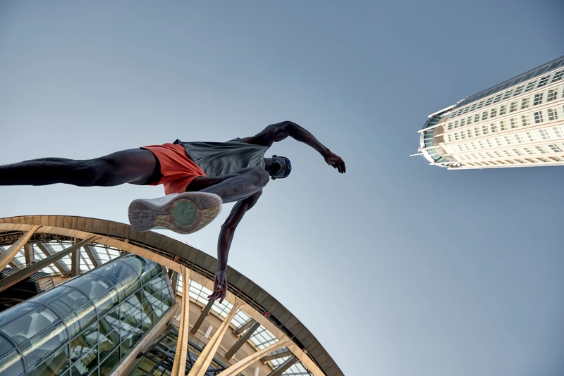 Running man above modern building