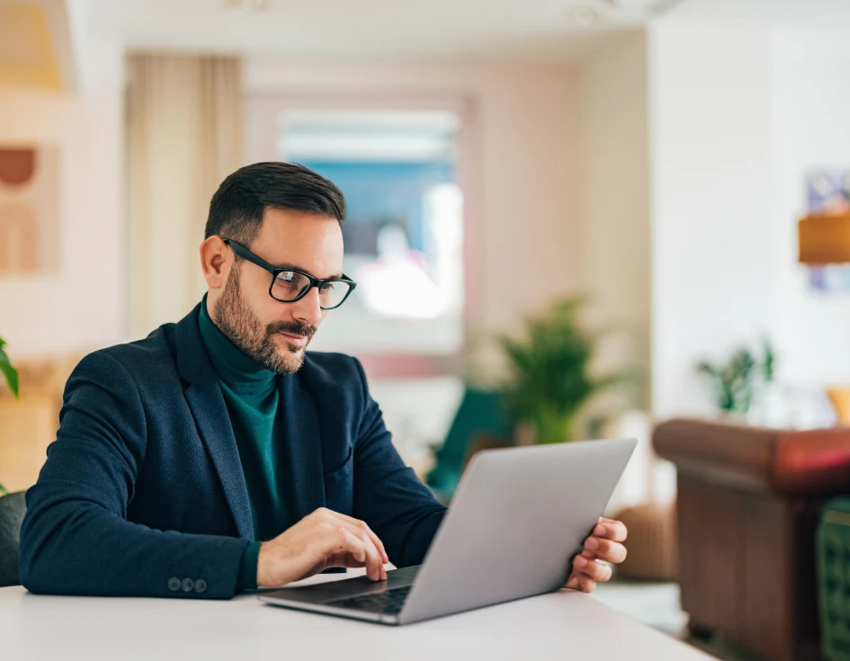 httc index milestone business owner working on laptop