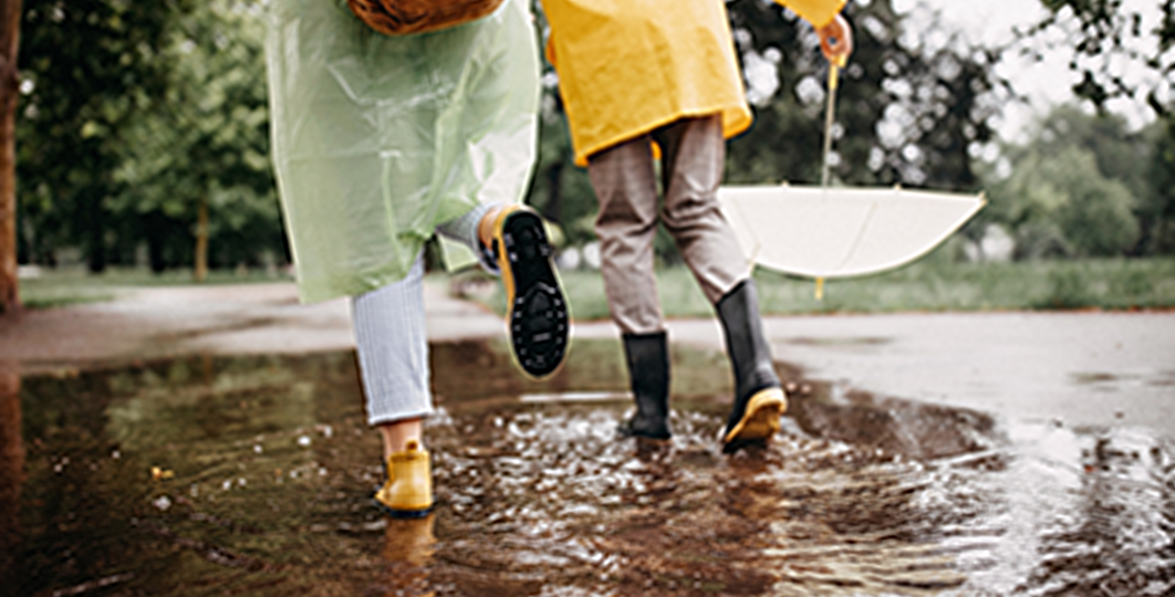 walking in rain with rainboots on