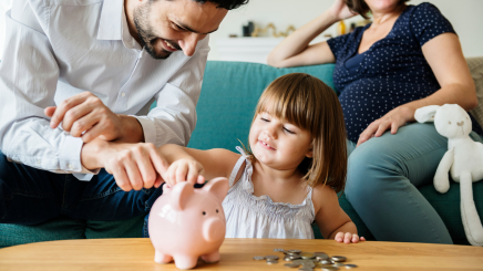 family teaching child about money rikoon