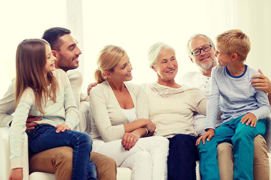 A family sitting on a couch