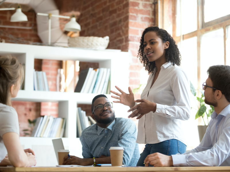 Woman Leading Meeting in Office