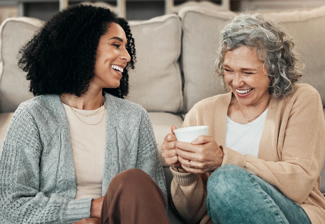 httc two women conversing and laughing