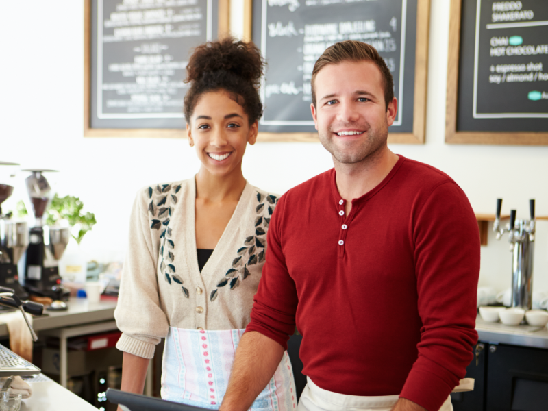 Young Business Owners Behind Counter