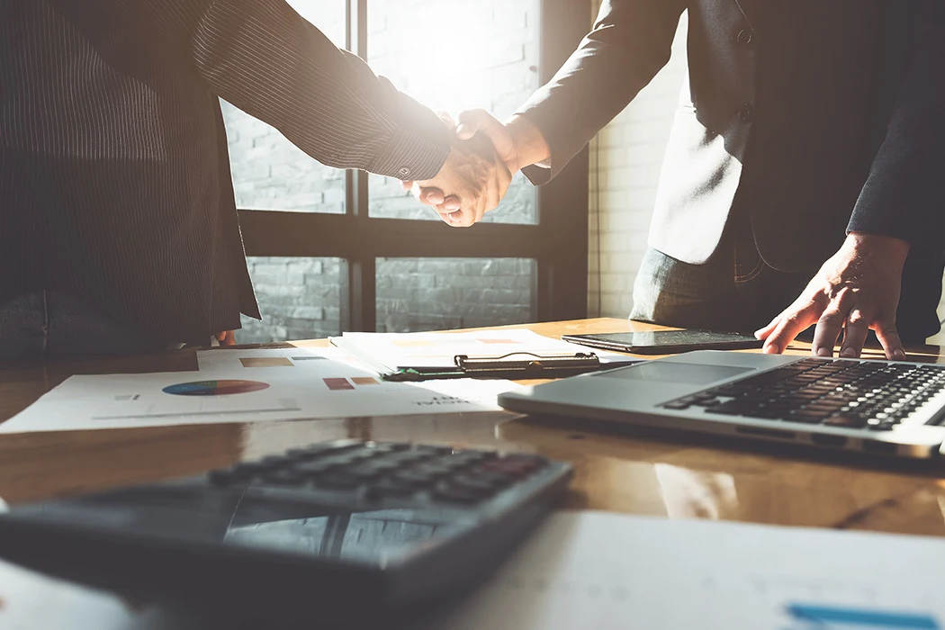 Two business people shaking hands