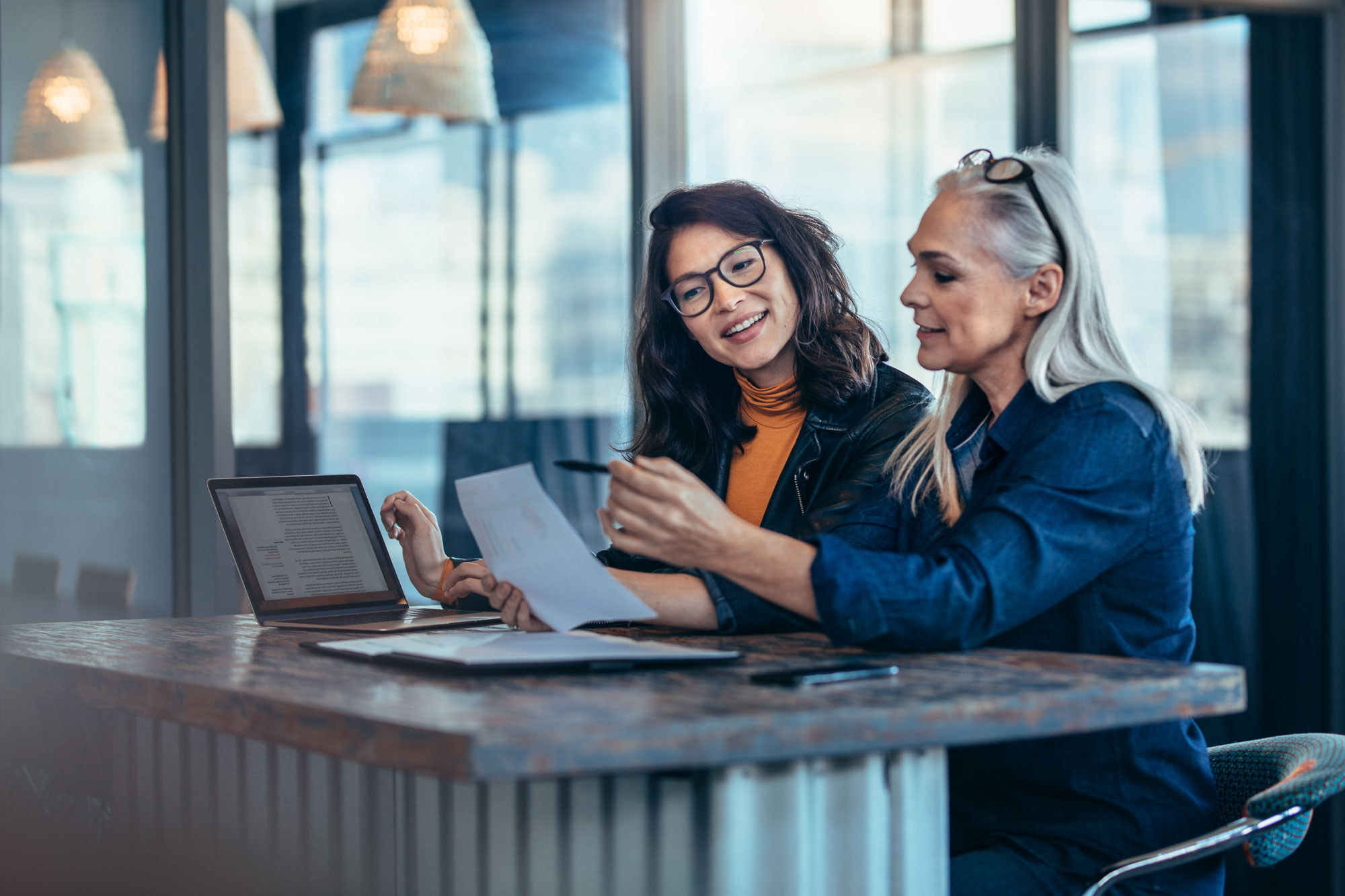 two women looking at a checklist