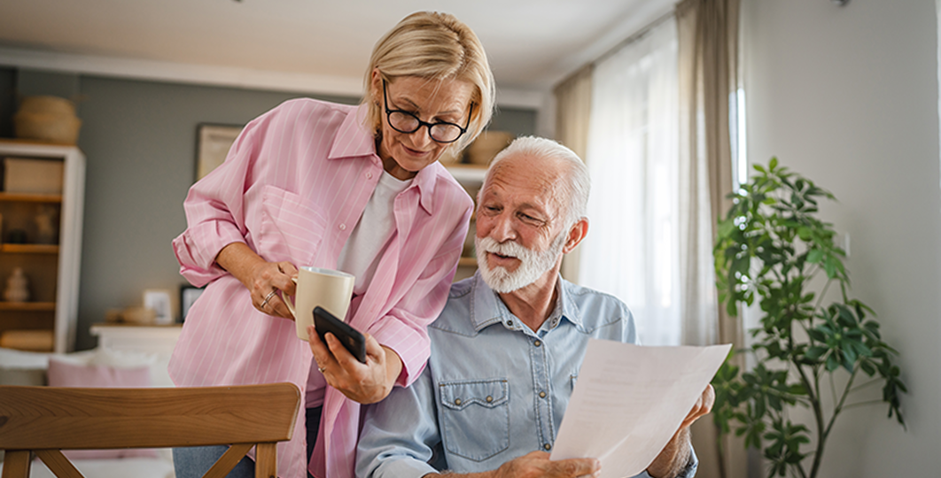 older couple examining retirement plan