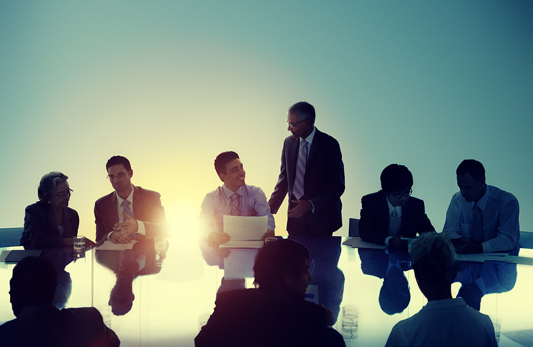 Business people working around a conference table