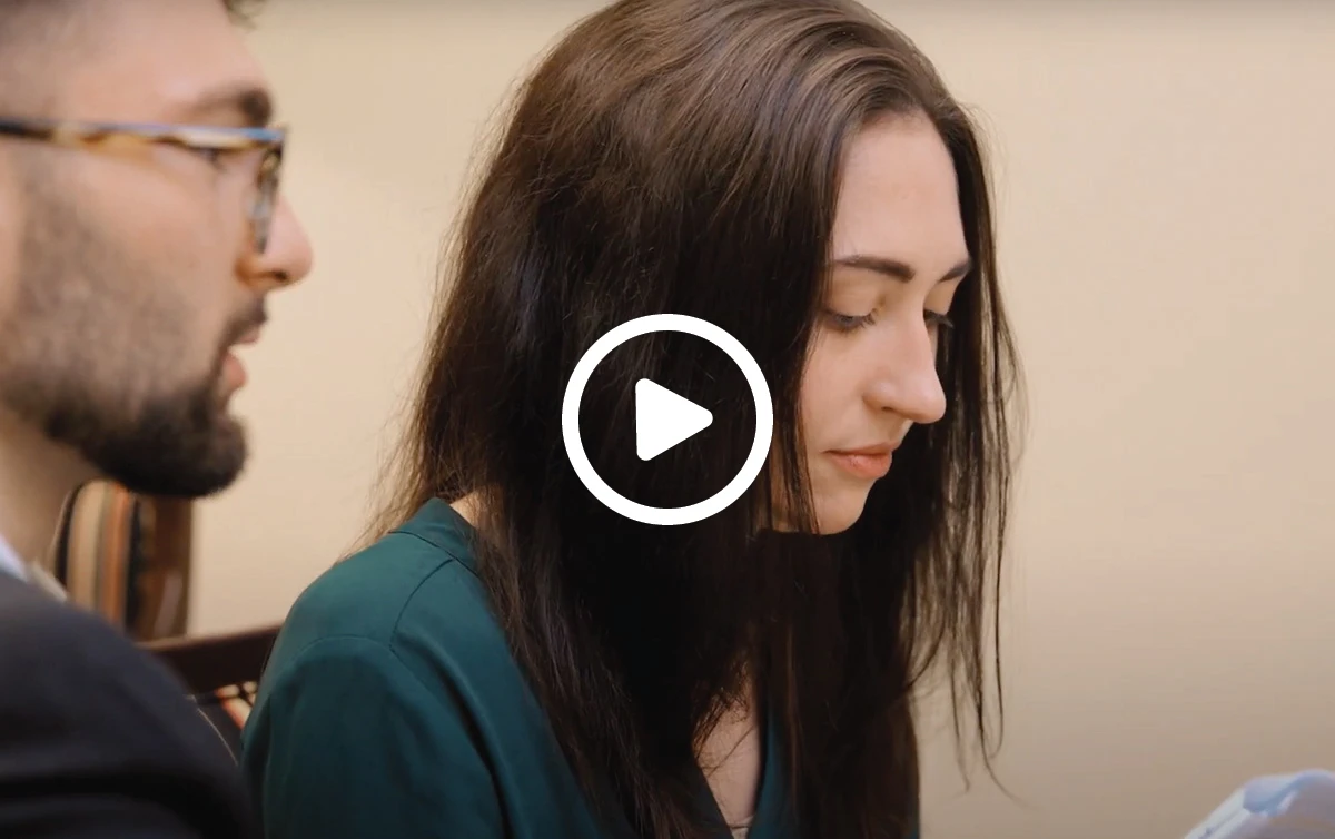 Woman looking at a financial plan with her financial advisor