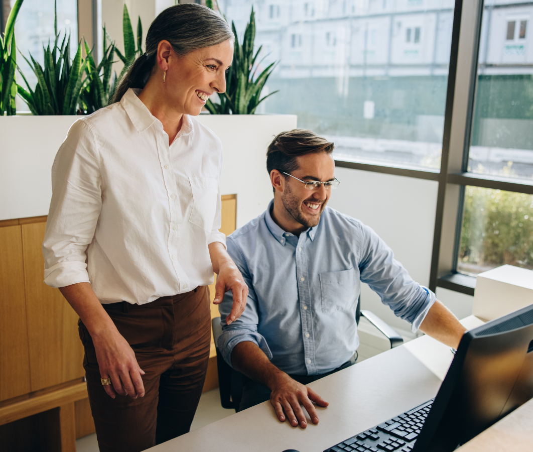 two people smiling at work