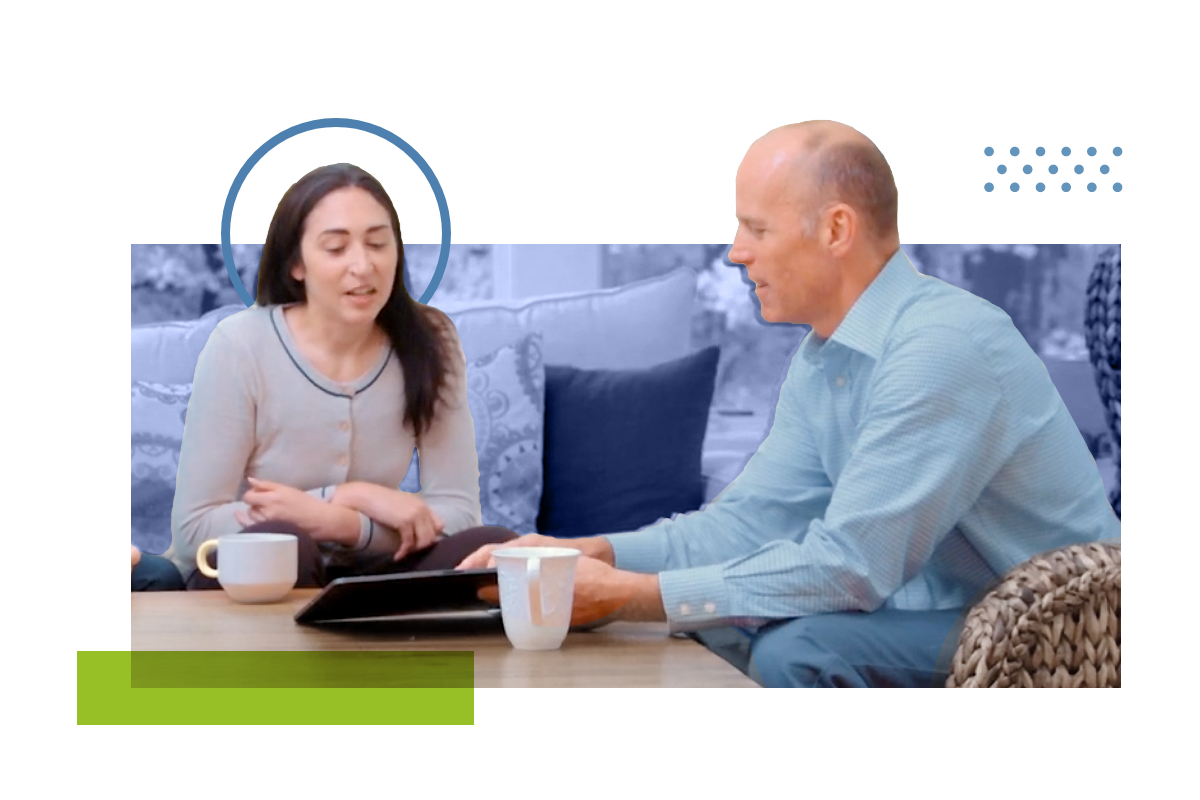 Woman sitting down with a financial planner near a table reviewing plan.