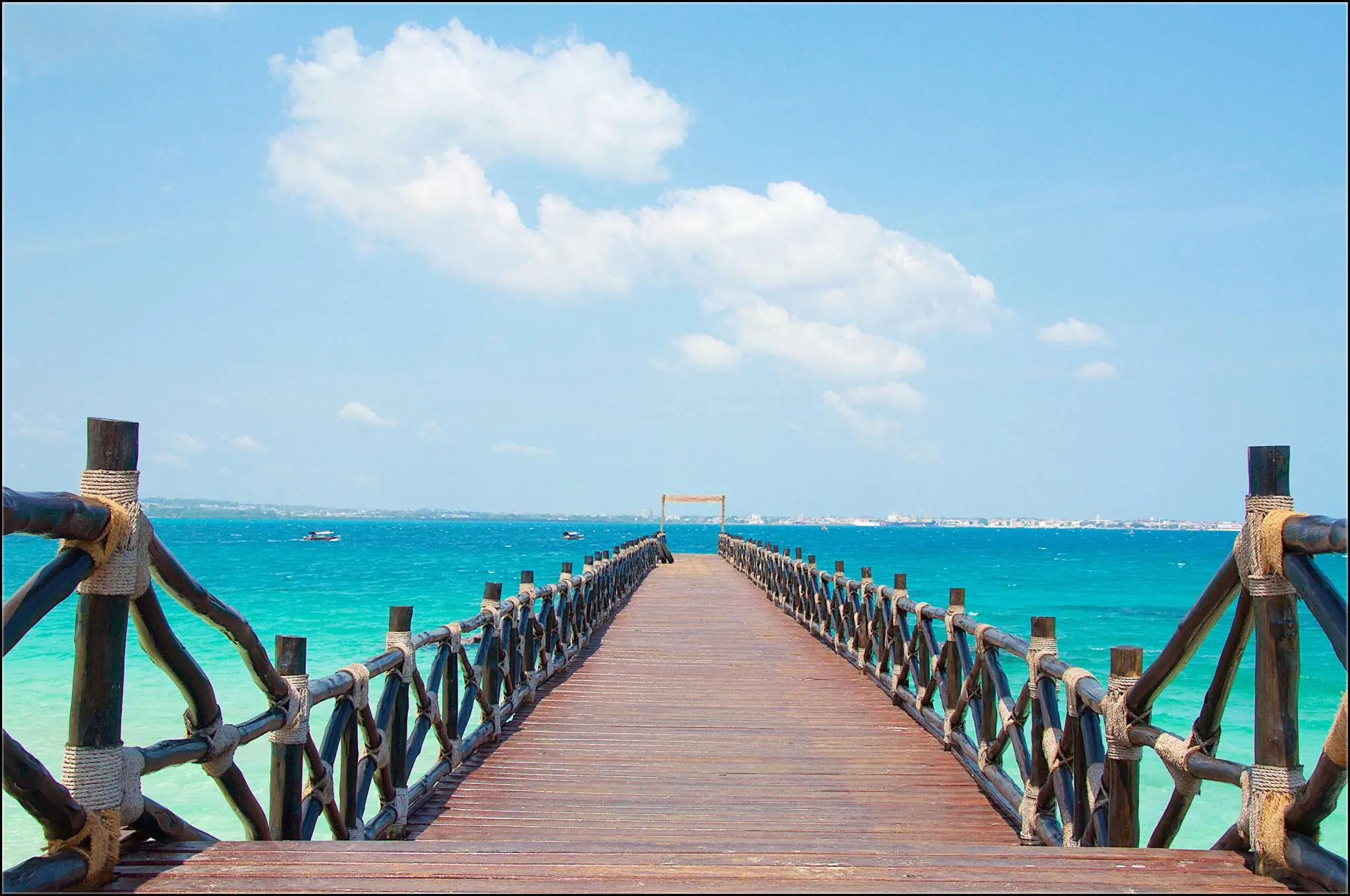 A long narrow pier extending into the ocean