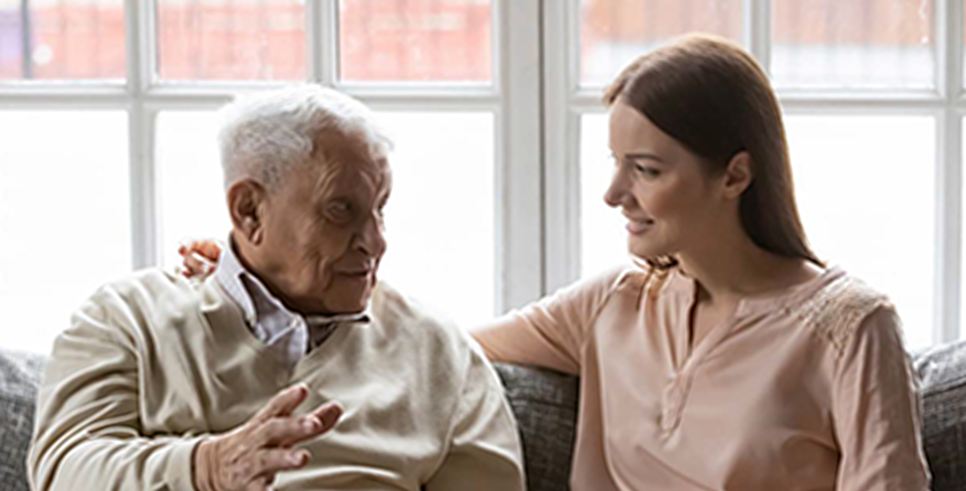 grandfather talking to granddaughter