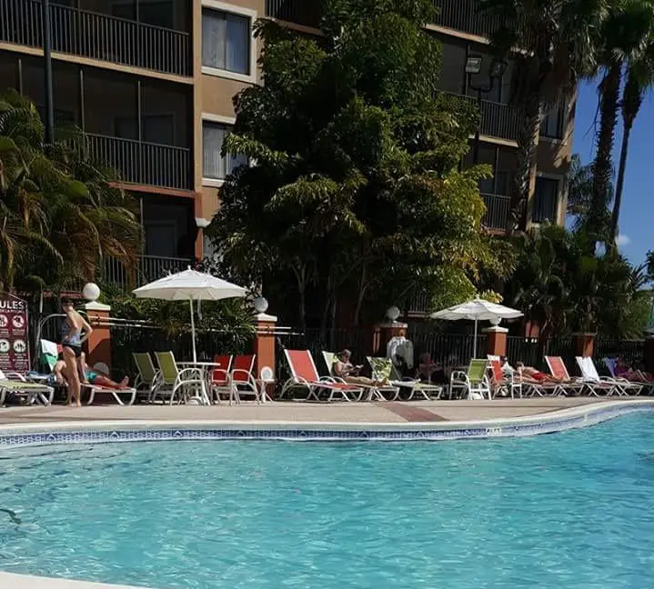 A swimming pool near a tall building