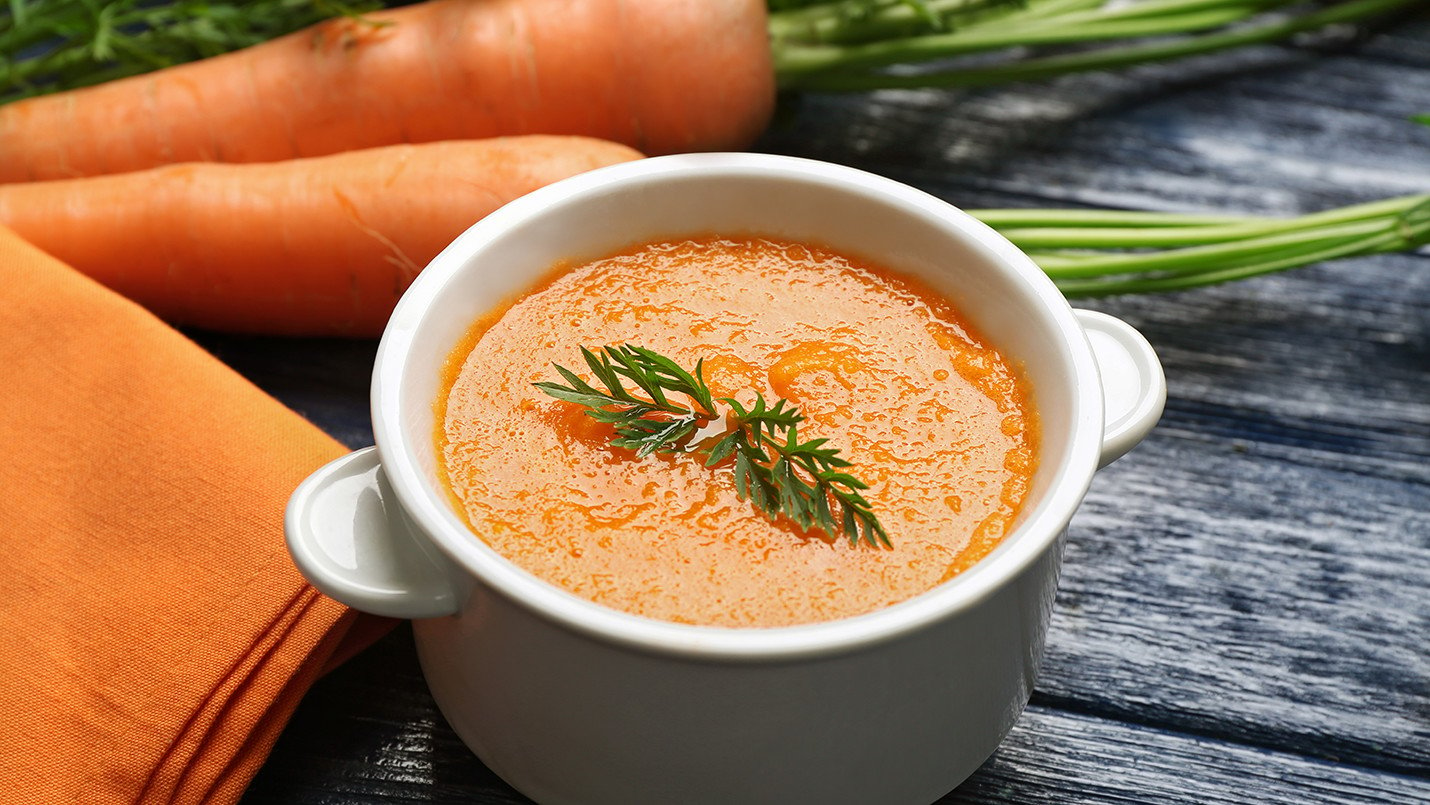 Cup of delicious cream of carrot soup 