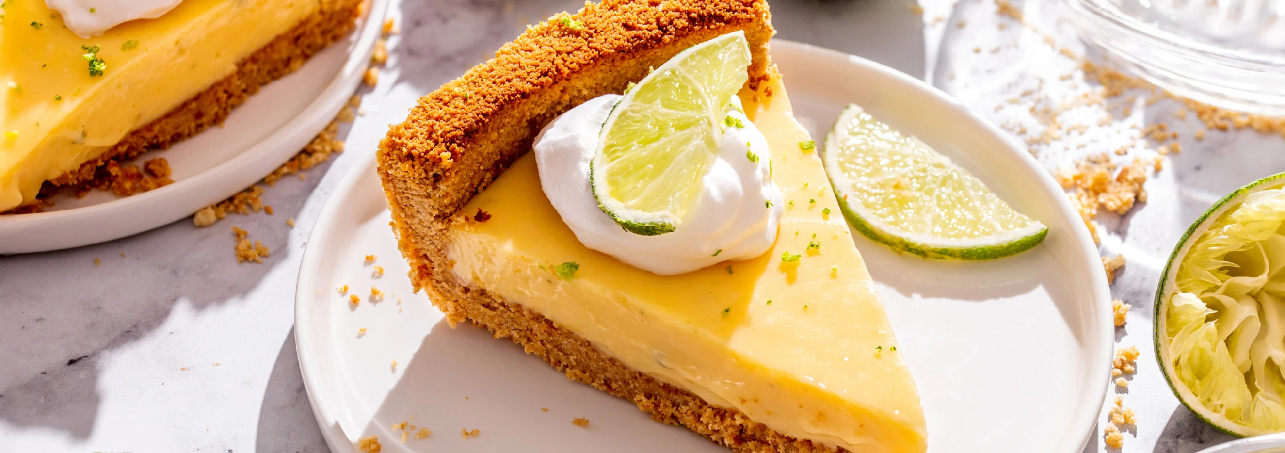 Slice of creamy lime pie topped with whipped cream