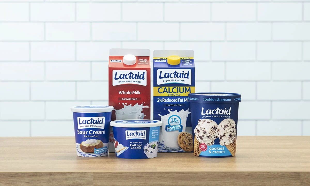 Variety of Lactaid products displayed, including Whole Milk, 2% Reduced Fat Milk, Sour Cream, Cottage Cheese, and Cookies & Cream Ice Cream.