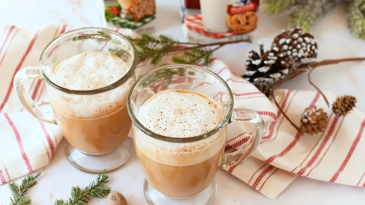 Lactose-Free Eggnog Latte Recipe | Lactaid® presented in glass cups, topped with frothy cream and holiday spices for a cozy drink