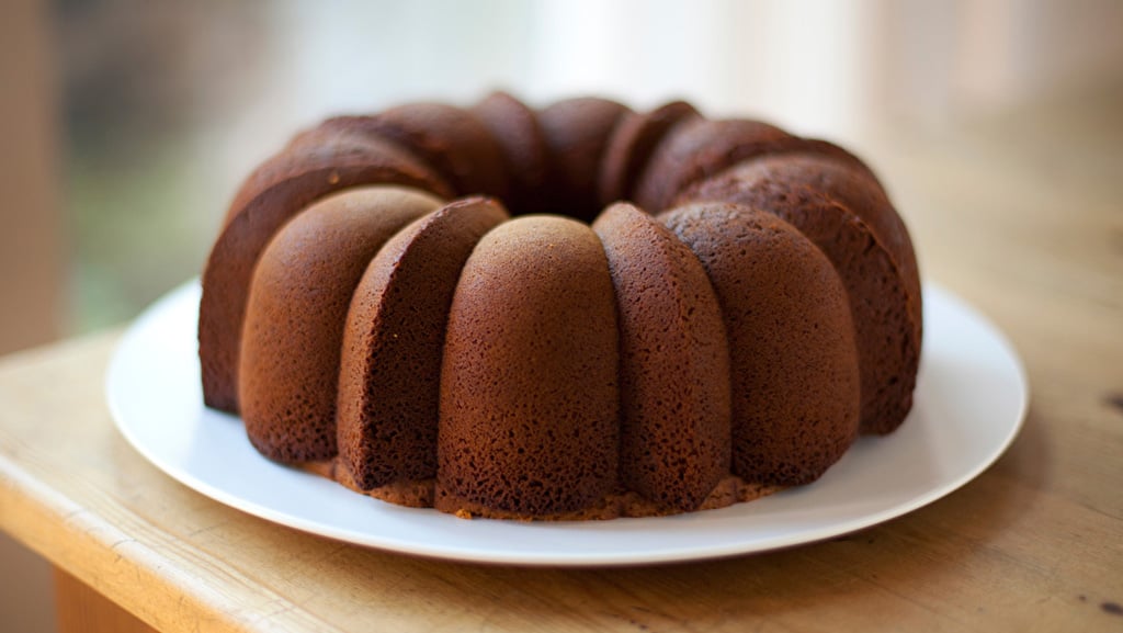 Milk chocolate bundt cake on white plate