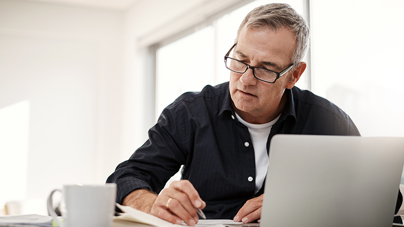 man-computer-calculating-mortgage-repayments
