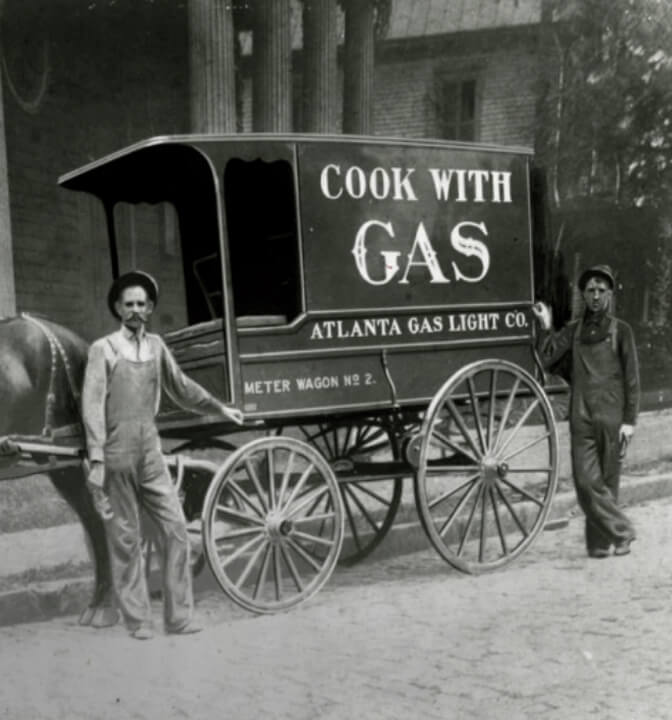 Historical photo of a 'Cook With Gas' Atlanta Gas Light horse drawn cart.
