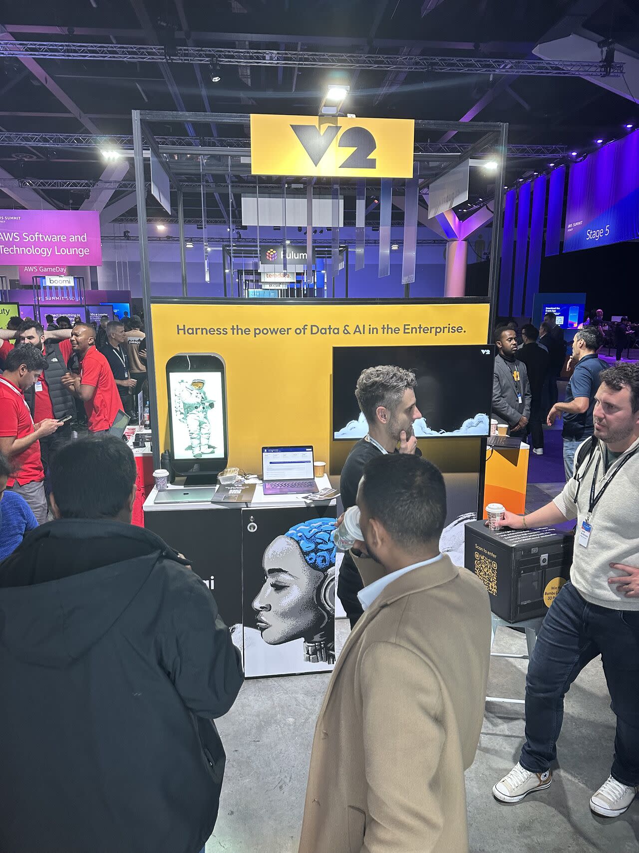 V2 booth summit