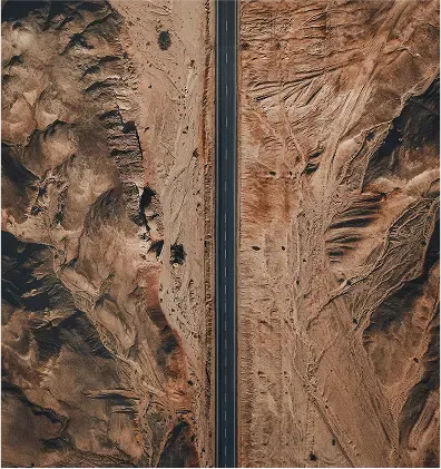 A highway in a barren rocky dessert area.